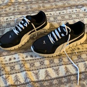 Black and white Puma athletic shoes